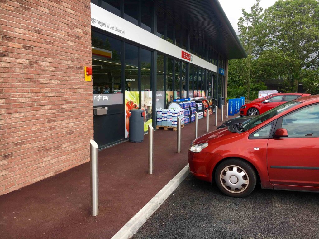 Stainless steel high street bollards outside retail shop